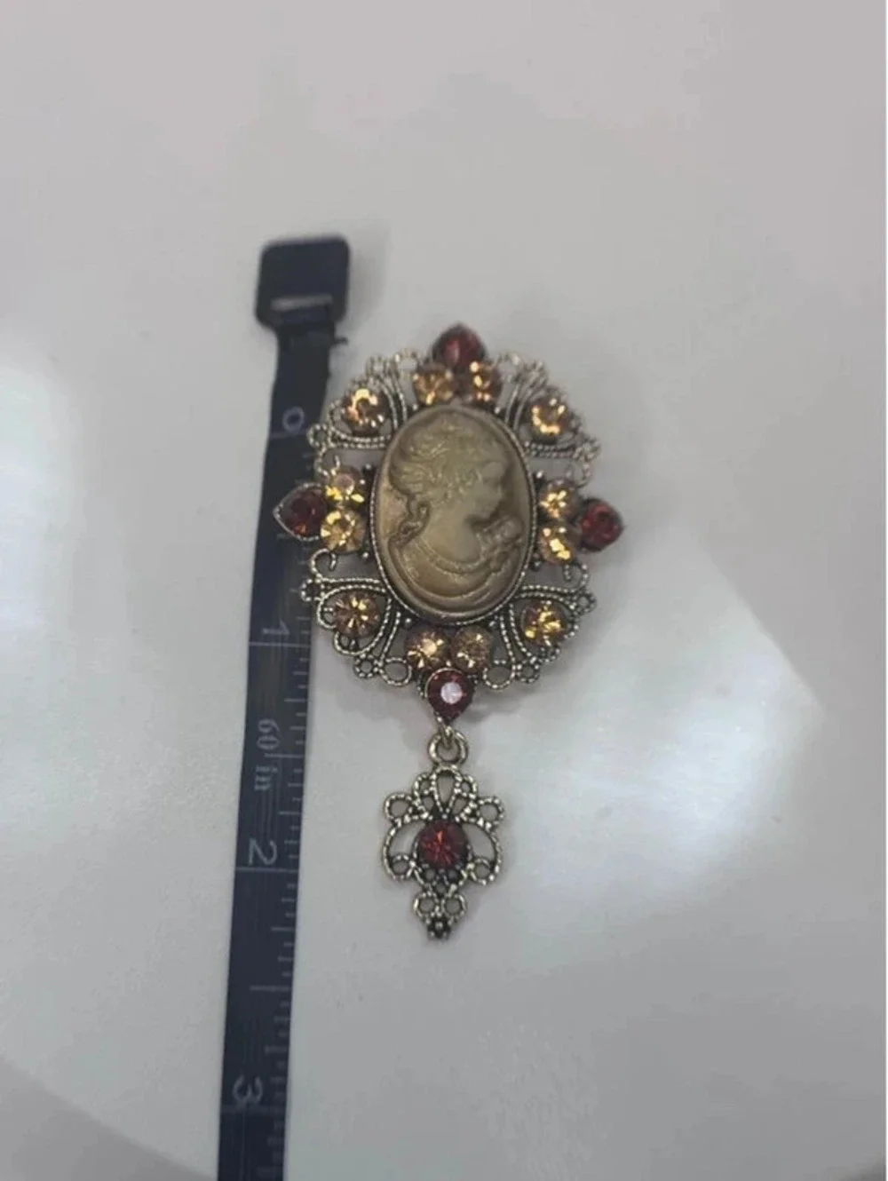 Victorian Revival cameo style brooch rhinestone dangle ornate gold tone pin